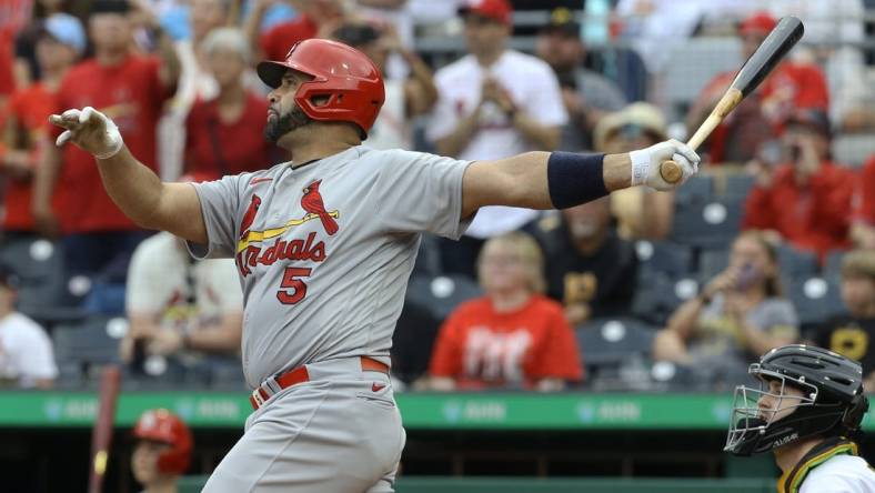 Sep 11, 2022; Pittsburgh, Pennsylvania, USA;  St. Louis Cardinals first baseman Albert Pujols (5) hits a two-run home run against the Pittsburgh Pirates during the ninth inning at PNC Park. The home run is the 697th home run of Pujols' career giving him sole possession of fourth place all time on the MLB career home run list. The Cardinals won 4-3. Mandatory Credit: Charles LeClaire-USA TODAY Sports