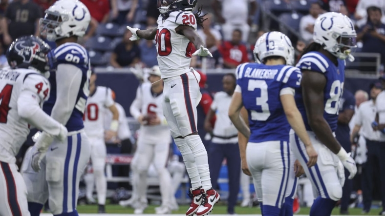 Sep 11, 2022; Houston, Texas, USA; Houston Texans cornerback Isaac Yiadom (20) leaps after Indianapolis Colts place kicker Rodrigo Blankenship (3) misses a field goal attempt during overtime at NRG Stadium. Mandatory Credit: Troy Taormina-USA TODAY Sports