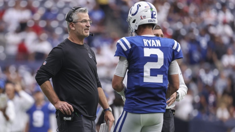 Sep 11, 2022; Houston, Texas, USA; Indianapolis Colts head coach Frank Reich talks with quarterback Matt Ryan (2) during overtime against the Houston Texans at NRG Stadium. Mandatory Credit: Troy Taormina-USA TODAY Sports