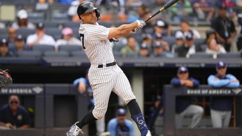 Sep 11, 2022; Bronx, New York, USA; New York Yankees designated hitter Giancarlo Stanton (27) hits a three run home run against the Tampa Bay Rays during the second inning at Yankee Stadium. Mandatory Credit: Gregory Fisher-USA TODAY Sports