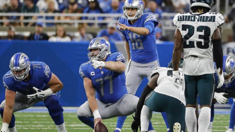 Sep 11, 2022; Detroit, Michigan, USA;  Detroit Lions quarterback Jared Goff (16) talks to center Frank Ragnow (77) against Philadelphia Eagles during the second half at Ford Field. Mandatory Credit: Junfu Han-USA TODAY Sports