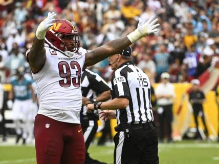 Sep 11, 2022; Landover, Maryland, USA; Washington Commanders defensive tackle Jonathan Allen (93) reacts after a sack against the Jacksonville Jaguars during the first half at FedExField. Mandatory Credit: Brad Mills-USA TODAY Sports