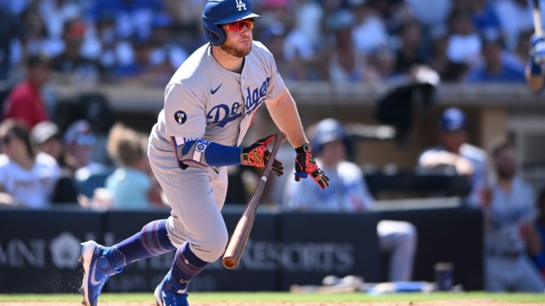 Sep 11, 2022; San Diego, California, USA; Los Angeles Dodgers designated hitter Max Muncy (13) hits a two-RBI single against the San Diego Padres during the sixth inning at Petco Park. Mandatory Credit: Orlando Ramirez-USA TODAY Sports