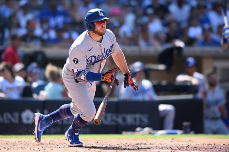 Sep 11, 2022; San Diego, California, USA; Los Angeles Dodgers designated hitter Max Muncy (13) hits a two-RBI single against the San Diego Padres during the sixth inning at Petco Park. Mandatory Credit: Orlando Ramirez-USA TODAY Sports