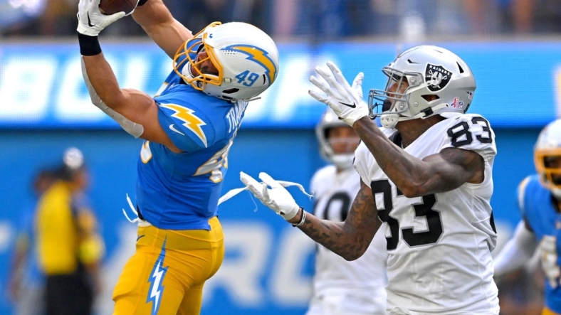 Sep 11, 2022; Inglewood, California, USA; Los Angeles Chargers linebacker Drue Tranquill (49) intercepts a pass intended for Las Vegas Raiders tight end Darren Waller (83) in the second quarter at SoFi Stadium. Mandatory Credit: Jayne Kamin-Oncea-USA TODAY Sports