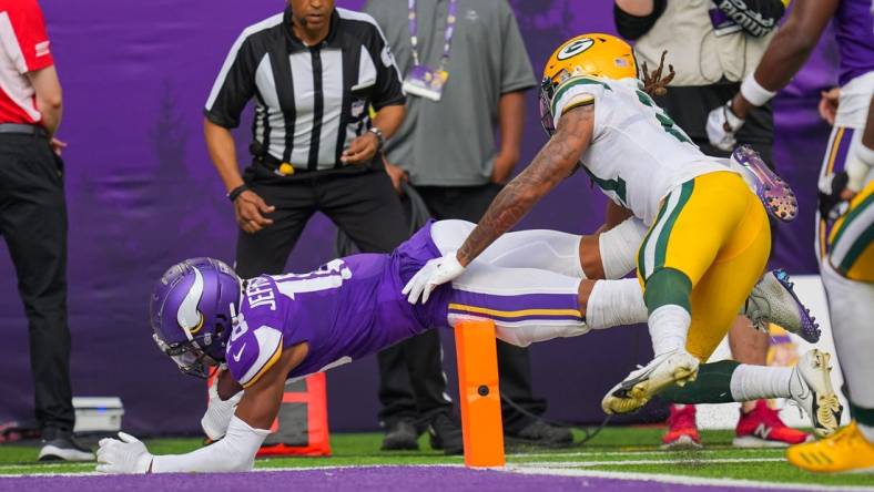 Sep 11, 2022; Minneapolis, Minnesota, USA; Minnesota Vikings wide receiver Justin Jefferson (18) dives for a touchdown against the Green Bay Packers in the second quarter at U.S. Bank Stadium. Mandatory Credit: Brad Rempel-USA TODAY Sports