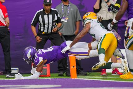 Sep 11, 2022; Minneapolis, Minnesota, USA; Minnesota Vikings wide receiver Justin Jefferson (18) dives for a touchdown against the Green Bay Packers in the second quarter at U.S. Bank Stadium. Mandatory Credit: Brad Rempel-USA TODAY Sports