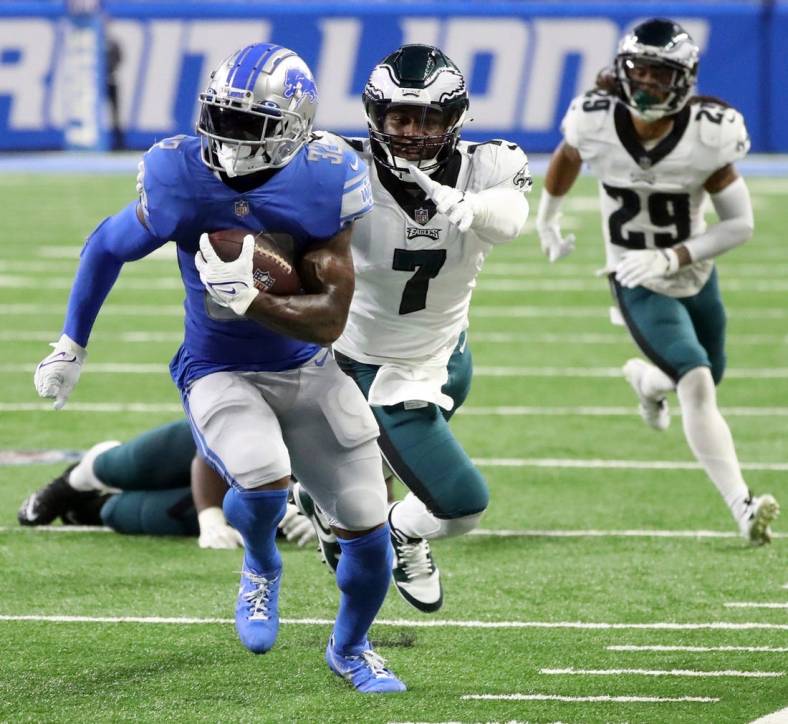 Lions running back D'Andre Swift runs by Eagles linebacker Haason Reddick during the second half of the Lions' 38-35 loss on Sunday, Sept.11, 2022, at Ford Field.

Nfl Philadelphia Eagles At Detroit Lions