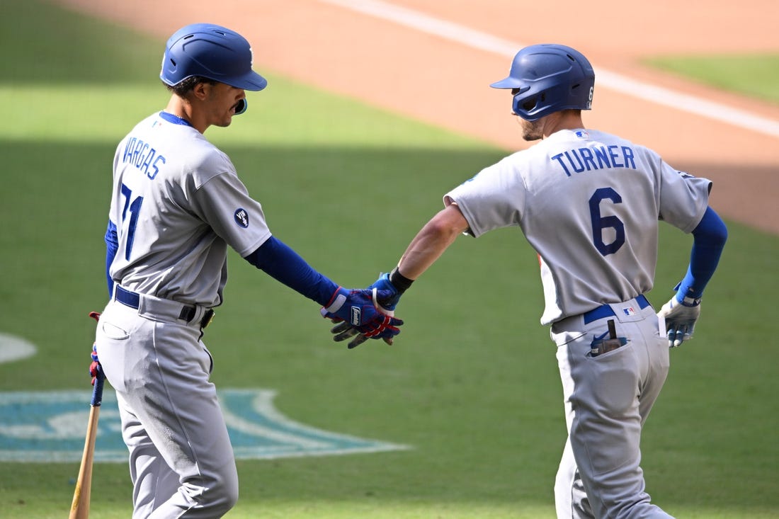 Sep 11, 2022; San Diego, California, USA; Los Angeles Dodgers shortstop Trea Turner (6) is congratulated by first baseman Miguel Vargas (71) after hitting a home run against the San Diego Padres during the ninth inning at Petco Park. Mandatory Credit: Orlando Ramirez-USA TODAY Sports