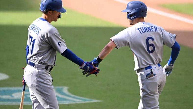 Sep 11, 2022; San Diego, California, USA; Los Angeles Dodgers shortstop Trea Turner (6) is congratulated by first baseman Miguel Vargas (71) after hitting a home run against the San Diego Padres during the ninth inning at Petco Park. Mandatory Credit: Orlando Ramirez-USA TODAY Sports