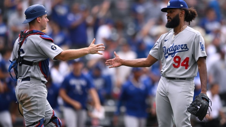 Sep 11, 2022; San Diego, California, USA; Los Angeles Dodgers relief pitcher Andre Jackson (94) and catcher Will Smith (left) celebrate after defeating the San Diego Padres at Petco Park. Mandatory Credit: Orlando Ramirez-USA TODAY Sports