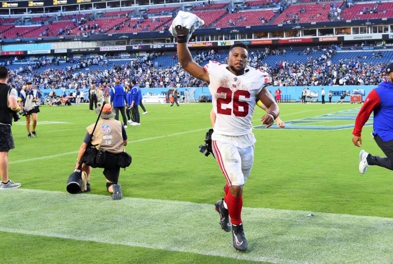 Sep 11, 2022; Nashville, Tennessee, USA; New York Giants running back Saquon Barkley (26) leaves the field after a win against the Tennessee Titans at Nissan Stadium. Mandatory Credit: Christopher Hanewinckel-USA TODAY Sports