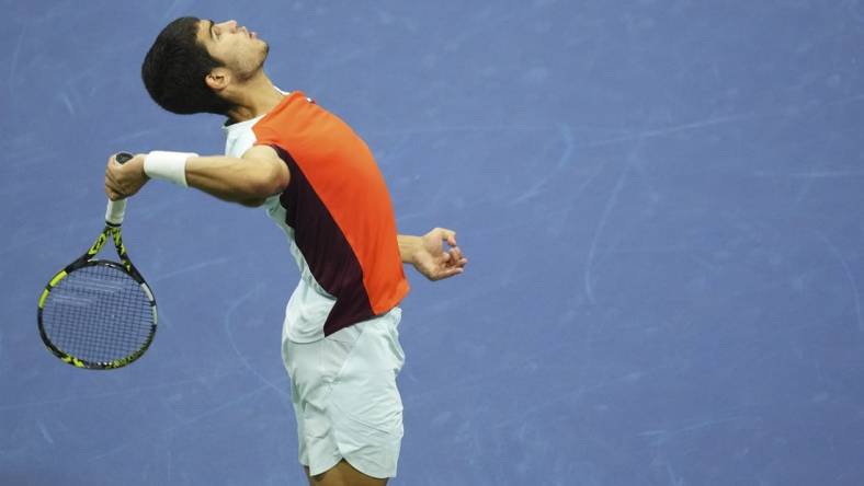 Sep 11, 2022; Flushing, NY, USA; Carlos Alcaraz (ESP) serves against Casper Ruud (NOR) (not pictured) in the men's singles final on day fourteen of the 2022 U.S. Open tennis tournament at USTA Billie Jean King Tennis Center. Mandatory Credit: Danielle Parhizkaran-USA TODAY Sports