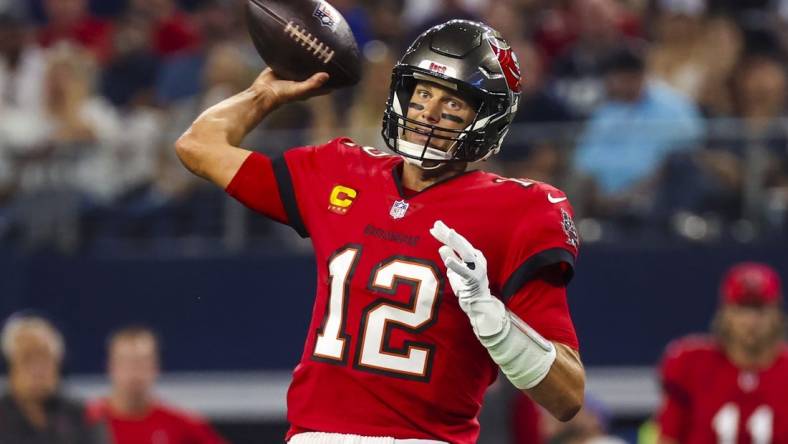 Sep 11, 2022; Arlington, Texas, USA;  Tampa Bay Buccaneers quarterback Tom Brady (12) throws during the first quarter against the Dallas Cowboys at AT&T Stadium. Mandatory Credit: Kevin Jairaj-USA TODAY Sports