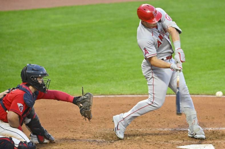 Sep 12, 2022; Cleveland, Ohio, USA; Los Angeles Angels center fielder Mike Trout (27) hits a two-run home run in the fifth inning against the Cleveland Guardians at Progressive Field. Mandatory Credit: David Richard-USA TODAY Sports