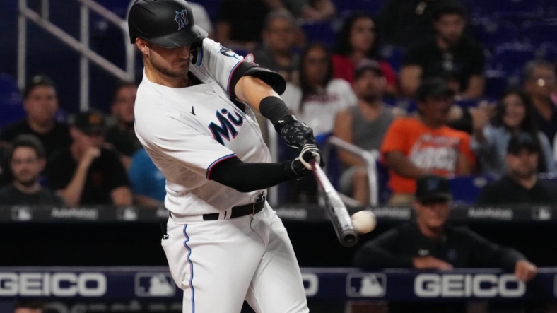 Sep 12, 2022; Miami, Florida, USA; Miami Marlins second baseman Charles Leblanc (83) doubles in a run in the fifth inning against the Texas Rangers at loanDepot park. Mandatory Credit: Jasen Vinlove-USA TODAY Sports