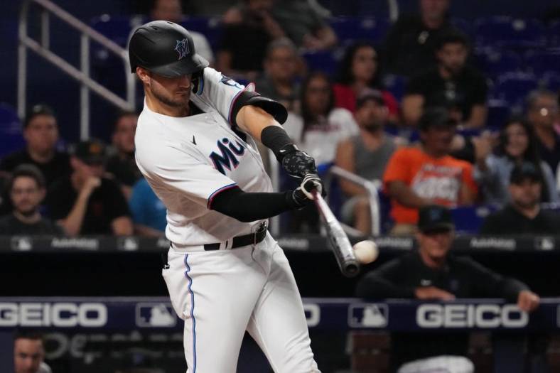 Sep 12, 2022; Miami, Florida, USA; Miami Marlins second baseman Charles Leblanc (83) doubles in a run in the fifth inning against the Texas Rangers at loanDepot park. Mandatory Credit: Jasen Vinlove-USA TODAY Sports