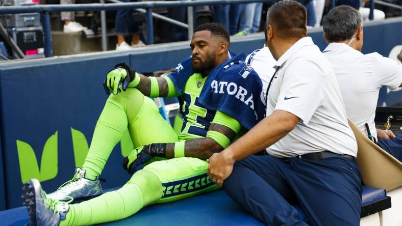 Sep 12, 2022; Seattle, Washington, USA; Seattle Seahawks safety Jamal Adams (33) is carted off during the second quarter following an injury against the Denver Broncos at Lumen Field. Mandatory Credit: Joe Nicholson-USA TODAY Sports