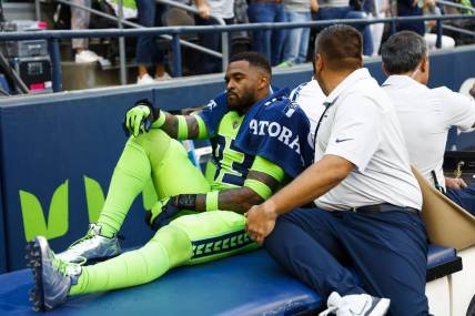 Sep 12, 2022; Seattle, Washington, USA; Seattle Seahawks safety Jamal Adams (33) is carted off during the second quarter following an injury against the Denver Broncos at Lumen Field. Mandatory Credit: Joe Nicholson-USA TODAY Sports