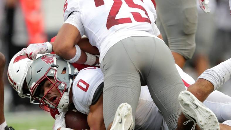 Washington State Cougars defensive back Sam Lockett III (0) recovers a fumble by Wisconsin Badgers tight end Clay Cundiff (not pictured) against Wisconsin Badgers wide receiver Chimere Dike (13) and Wisconsin Badgers linebacker Jake Ratzlaff (25) late in the fourth quarter during their football game Saturday, September 10, 2022, at Camp Randall in Madison, Wis.

Mjs Apc Badgersvswash 0910221722djp