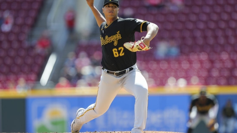 Sep 13, 2022; Cincinnati, Ohio, USA; Pittsburgh Pirates starting pitcher Johan Oviedo (62) pitches against the Cincinnati Reds in the first inning at Great American Ball Park. Mandatory Credit: Katie Stratman-USA TODAY Sports