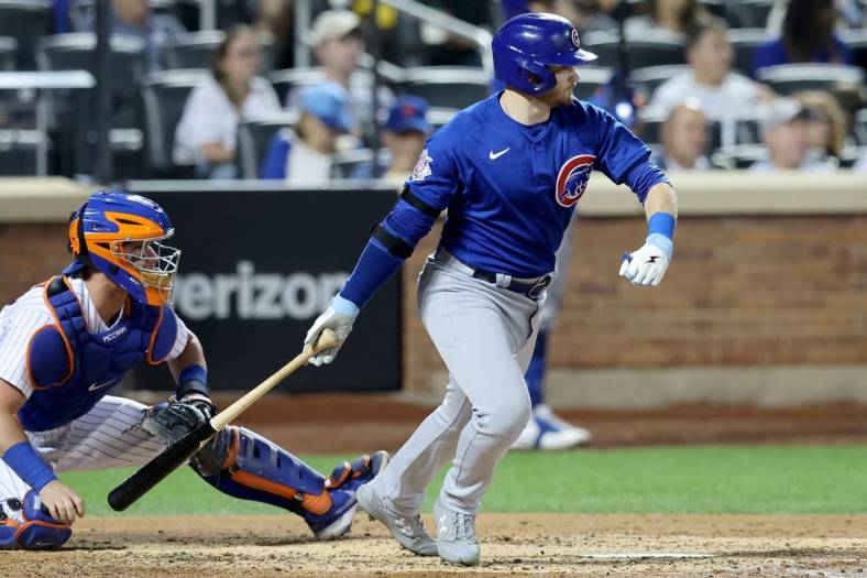 Sep 13, 2022; New York City, New York, USA; Chicago Cubs left fielder Ian Happ (8) follows through on a single against the New York Mets during the fourth inning at Citi Field. Mandatory Credit: Brad Penner-USA TODAY Sports