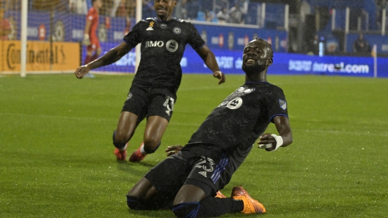 Sep 13, 2022; Montreal, Quebec, CAN; CF Montreal forward Kei Kamara (23) celebrates with teammate forward Mason Toye (13) after scoring a goal against Chicago Fire FC goalkeeper Gaga Slolina (1) during the first half at Stade Saputo. Mandatory Credit: Eric Bolte-USA TODAY Sports