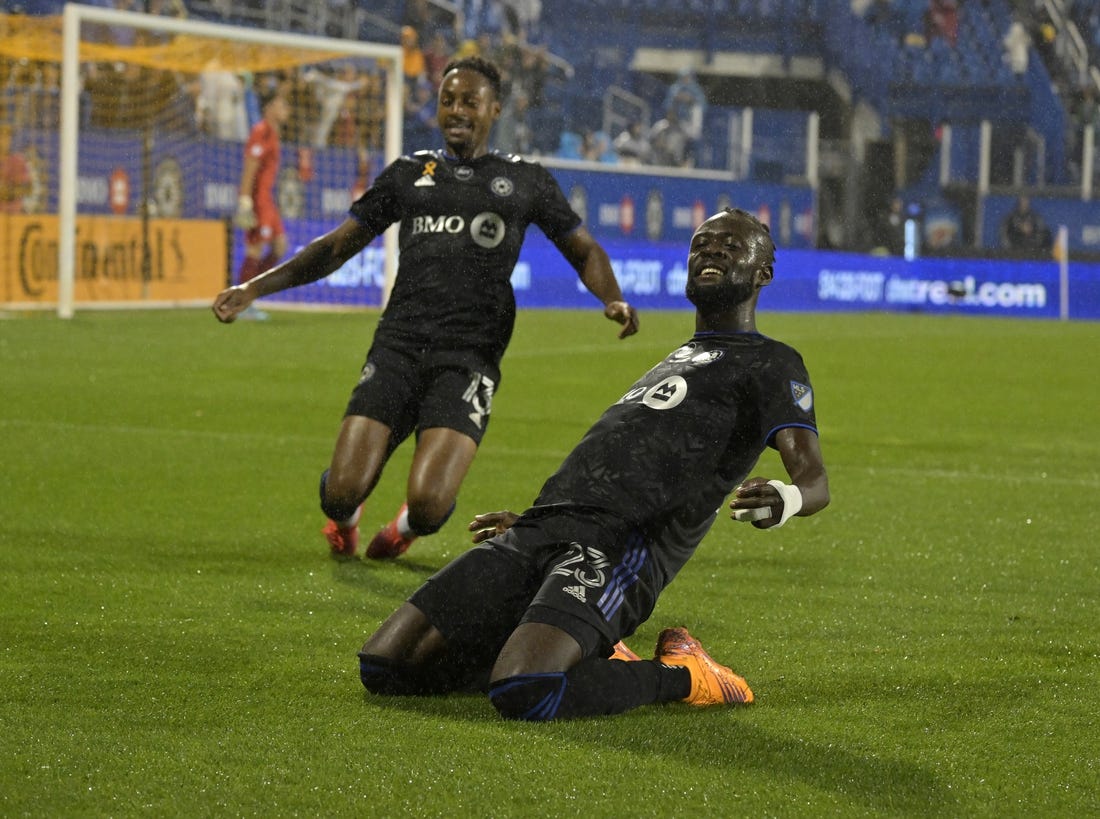 Sep 13, 2022; Montreal, Quebec, CAN; CF Montreal forward Kei Kamara (23) celebrates with teammate 
forward Mason Toye (13) after scoring a goal against Chicago Fire FC goalkeeper Gaga Slolina (1) during the first half at Stade Saputo. Mandatory Credit: Eric Bolte-USA TODAY Sports