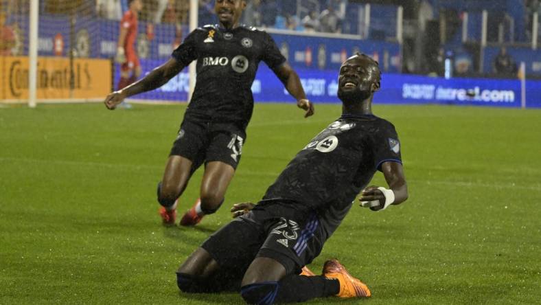 Sep 13, 2022; Montreal, Quebec, CAN; CF Montreal forward Kei Kamara (23) celebrates with teammate 
forward Mason Toye (13) after scoring a goal against Chicago Fire FC goalkeeper Gaga Slolina (1) during the first half at Stade Saputo. Mandatory Credit: Eric Bolte-USA TODAY Sports