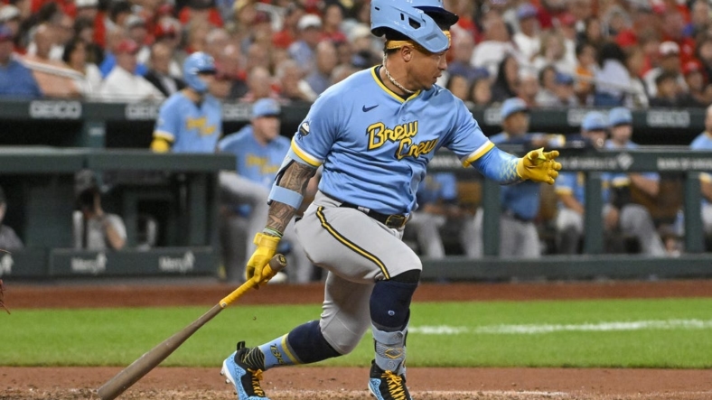 Sep 13, 2022; St. Louis, Missouri, USA;  Milwaukee Brewers second baseman Kolten Wong (16) loses his helmet as he hits in to a fielders choice during the sixth inning at Busch Stadium. Mandatory Credit: Jeff Curry-USA TODAY Sports