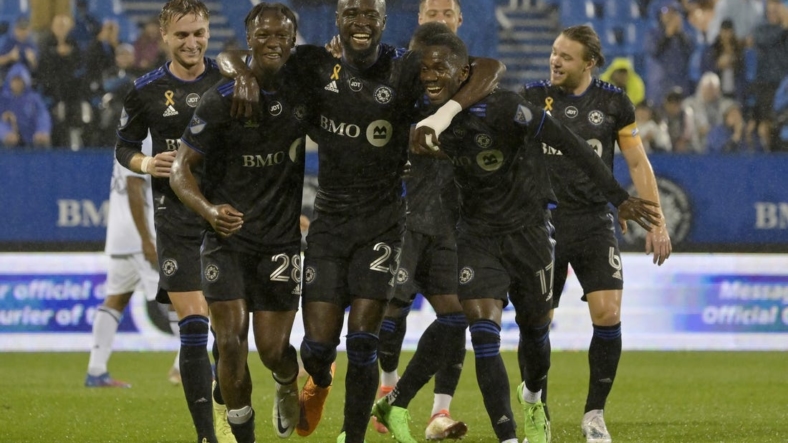 Sep 13, 2022; Montreal, Quebec, CAN; CF Montreal forward Kei Kamara (23) celebrates with teammates including midfielder Djordje Mihailovic (8) and midfielder Ismael Kone (28) and forward Jojea Kwizera (17) after scoring his second goal against the Chicago Fire FC during the first half at Stade Saputo. Mandatory Credit: Eric Bolte-USA TODAY Sports