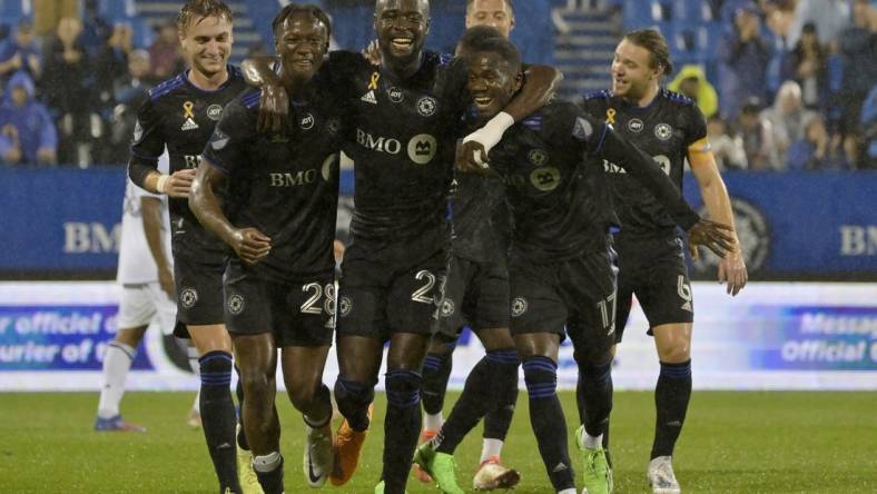 Sep 13, 2022; Montreal, Quebec, CAN; CF Montreal forward Kei Kamara (23) celebrates with teammates including midfielder Djordje Mihailovic (8) and midfielder Ismael Kone (28) and forward Jojea Kwizera (17) after scoring his second goal against the Chicago Fire FC during the first half at Stade Saputo. Mandatory Credit: Eric Bolte-USA TODAY Sports