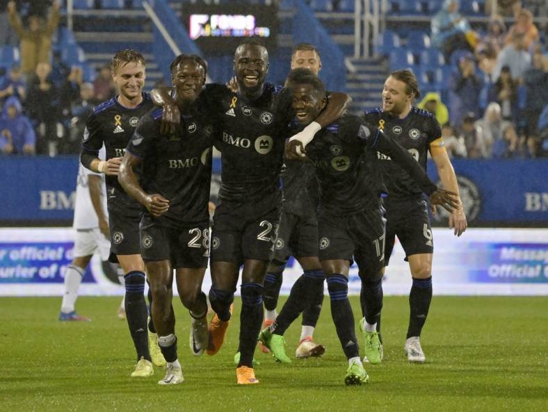 Sep 13, 2022; Montreal, Quebec, CAN; CF Montreal forward Kei Kamara (23) celebrates with teammates including midfielder Djordje Mihailovic (8) and midfielder Ismael Kone (28) and forward Jojea Kwizera (17) after scoring his second goal against the Chicago Fire FC during the first half at Stade Saputo. Mandatory Credit: Eric Bolte-USA TODAY Sports