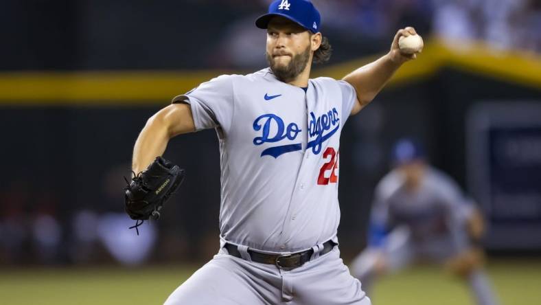 Sep 13, 2022; Phoenix, Arizona, USA; Los Angeles Dodgers pitcher Clayton Kershaw (22) throws in the first inning against the Arizona Diamondbacks at Chase Field. Mandatory Credit: Mark J. Rebilas-USA TODAY Sports