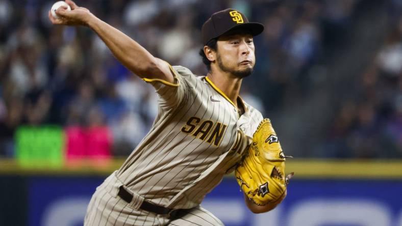 Sep 13, 2022; Seattle, Washington, USA; San Diego Padres starting pitcher Yu Darvish (11) throws against the Seattle Mariners during the third inning at T-Mobile Park. Mandatory Credit: Joe Nicholson-USA TODAY Sports