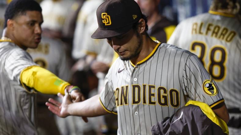 Sep 13, 2022; Seattle, Washington, USA; San Diego Padres starting pitcher Yu Darvish (right) high fives right fielder Juan Soto (22) following the eighth inning against the Seattle Mariners at T-Mobile Park. Mandatory Credit: Joe Nicholson-USA TODAY Sports