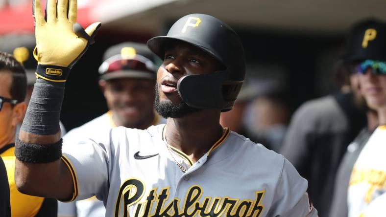 Sep 14, 2022; Cincinnati, Ohio, USA; Pittsburgh Pirates shortstop Rodolfo Castro (14) celebrates in the dugout after hitting a three-run home run against the Cincinnati Reds during the third inning at Great American Ball Park. Mandatory Credit: David Kohl-USA TODAY Sports