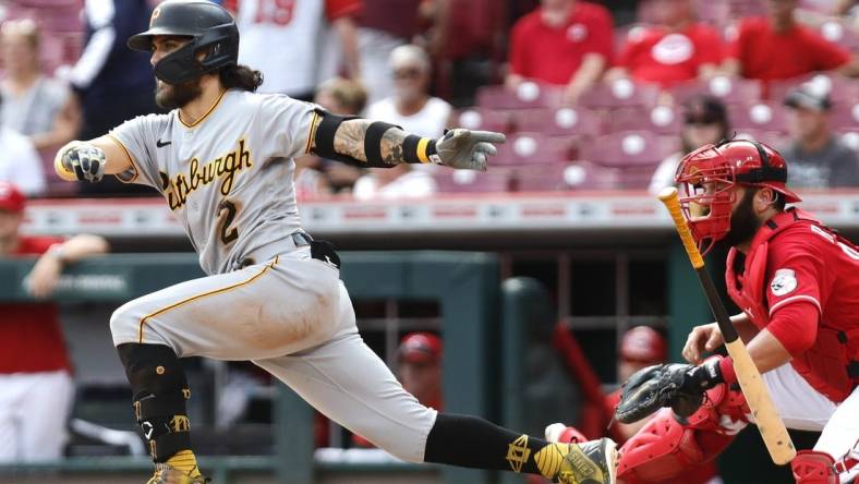 Sep 14, 2022; Cincinnati, Ohio, USA; Pittsburgh Pirates first baseman Michael Chavis (2) hits a two-run single against the Cincinnati Reds during the ninth inning at Great American Ball Park. Mandatory Credit: David Kohl-USA TODAY Sports