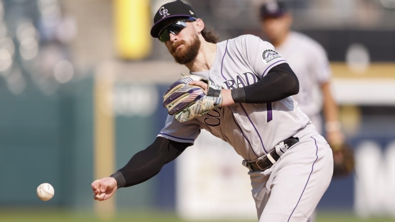 Sep 14, 2022; Chicago, Illinois, USA; Colorado Rockies second baseman Brendan Rodgers (7) throws to first base for an out against the Chicago White Sox during the sixth inning at Guaranteed Rate Field. Mandatory Credit: Kamil Krzaczynski-USA TODAY Sports