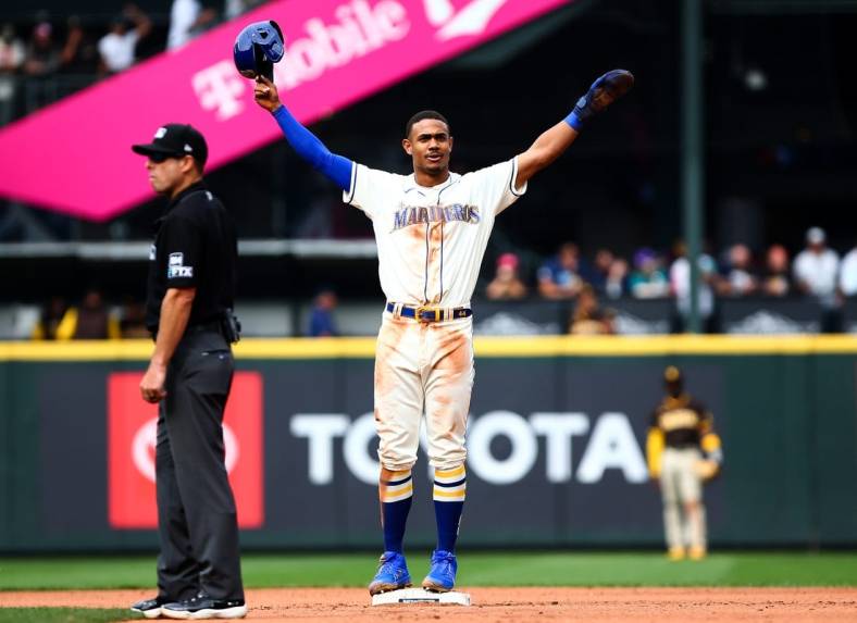 Sep 14, 2022; Seattle, Washington, USA;  Seattle Mariners center fielder Julio Rodriguez (44) acknowledges the crowd after stealing second base to reach 25 home runs and 25 stolen bases for the year at T-Mobile Park. Mandatory Credit: Lindsey Wasson-USA TODAY Sports
