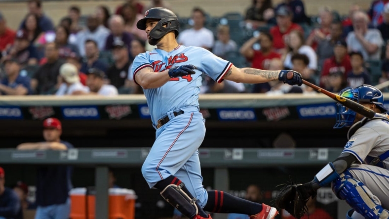 Sep 14, 2022; Minneapolis, Minnesota, USA; Minnesota Twins designated hitter Gary Sanchez (24) hits a two-RBI double during the first inning against the Kansas City Royals at Target Field. Mandatory Credit: Jordan Johnson-USA TODAY Sports