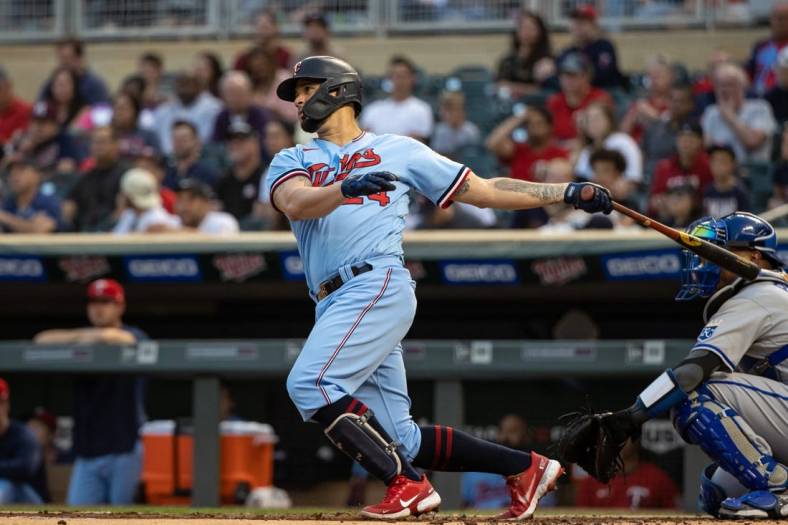 Sep 14, 2022; Minneapolis, Minnesota, USA; Minnesota Twins designated hitter Gary Sanchez (24) hits a two-RBI double during the first inning against the Kansas City Royals at Target Field. Mandatory Credit: Jordan Johnson-USA TODAY Sports