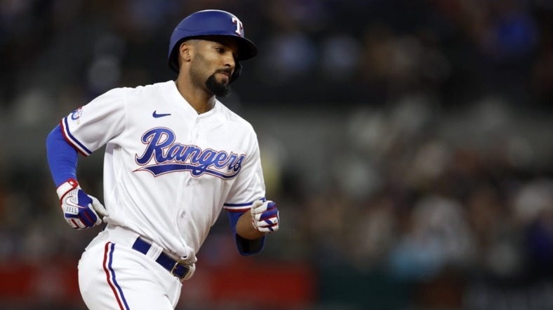 Sep 14, 2022; Arlington, Texas, USA; Texas Rangers second baseman Marcus Semien (2) rounds the bases after hitting a three-run home run against the Oakland Athletics in the second inning at Globe Life Field. Mandatory Credit: Tim Heitman-USA TODAY Sports