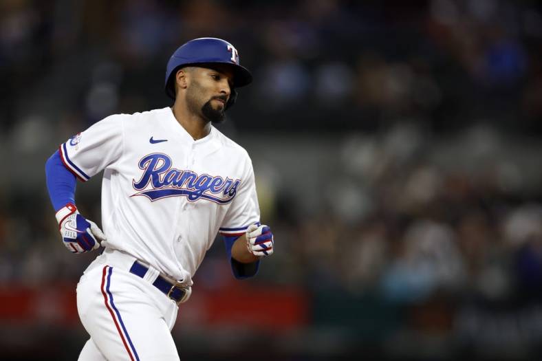Sep 14, 2022; Arlington, Texas, USA; Texas Rangers second baseman Marcus Semien (2) rounds the bases after hitting a three-run home run against the Oakland Athletics in the second inning at Globe Life Field. Mandatory Credit: Tim Heitman-USA TODAY Sports