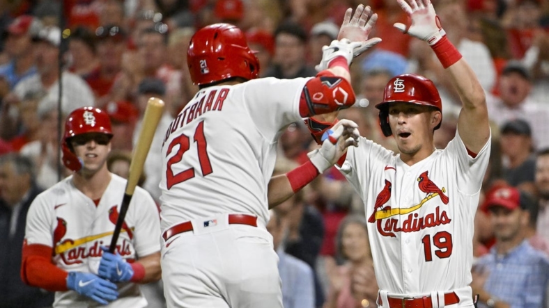 Sep 14, 2022; St. Louis, Missouri, USA;  St. Louis Cardinals center fielder Lars Nootbaar (21) is congratulated by second baseman Tommy Edman (19) after hitting a solo home run against the Milwaukee Brewers during the fifth inning at Busch Stadium. Mandatory Credit: Jeff Curry-USA TODAY Sports