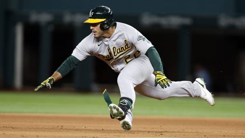 Sep 14, 2022; Arlington, Texas, USA; Oakland Athletics center fielder Ramon Laureano (22) dives into second base with a double in the fifth inning against the Texas Rangers at Globe Life Field. Mandatory Credit: Tim Heitman-USA TODAY Sports