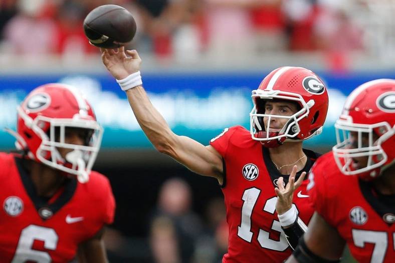Georgia quarterback Stetson Bennett (13) throws a touchdown during the first half of a college football game between Samford and Georgia in Athens, Ga., on Saturday, Sept. 10, 2022.

Syndication Online Athens