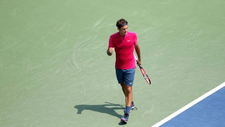 Roger Federer pumps his fist as he wins a point over Novak Djokovic in the Western and Southern Open finals at the Lindner Family Tennis Center in Mason on Sunday, Aug. 23, 2015.  Federer won (7-6 (1), 6-3.

Uscpcent02 6lxulhqu48mo8ptme37 Original