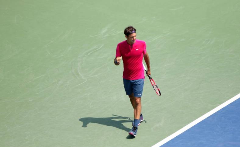 Roger Federer pumps his fist as he wins a point over Novak Djokovic in the Western and Southern Open finals at the Lindner Family Tennis Center in Mason on Sunday, Aug. 23, 2015.  Federer won (7-6 (1), 6-3.

Uscpcent02 6lxulhqu48mo8ptme37 Original