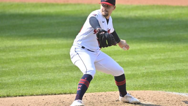 Sep 15, 2022; Cleveland, Ohio, USA; Cleveland Guardians relief pitcher Kirk McCarty (59) delivers a pitch in the ninth inning against the Chicago White Sox at Progressive Field. Mandatory Credit: David Richard-USA TODAY Sports